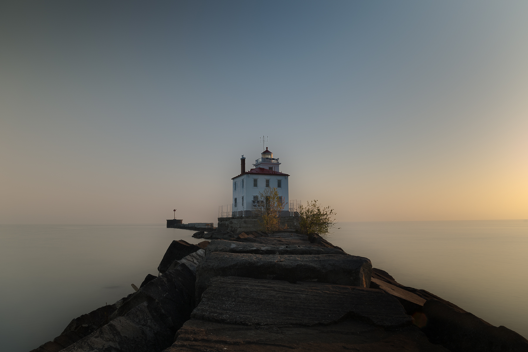 Fairport Harbor lighthouse floating in morning mist over Lake Erie, Ohio