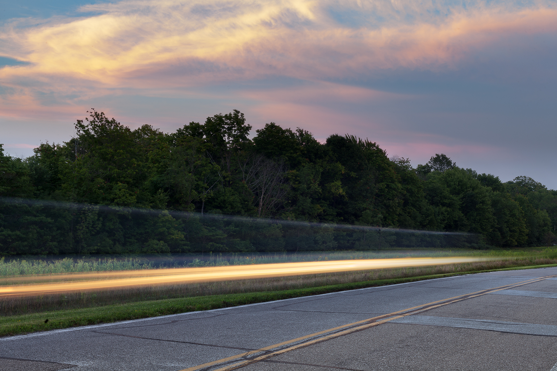 Long exposure light trail on road at dusk, Holden Arboretum, Northeast Ohio