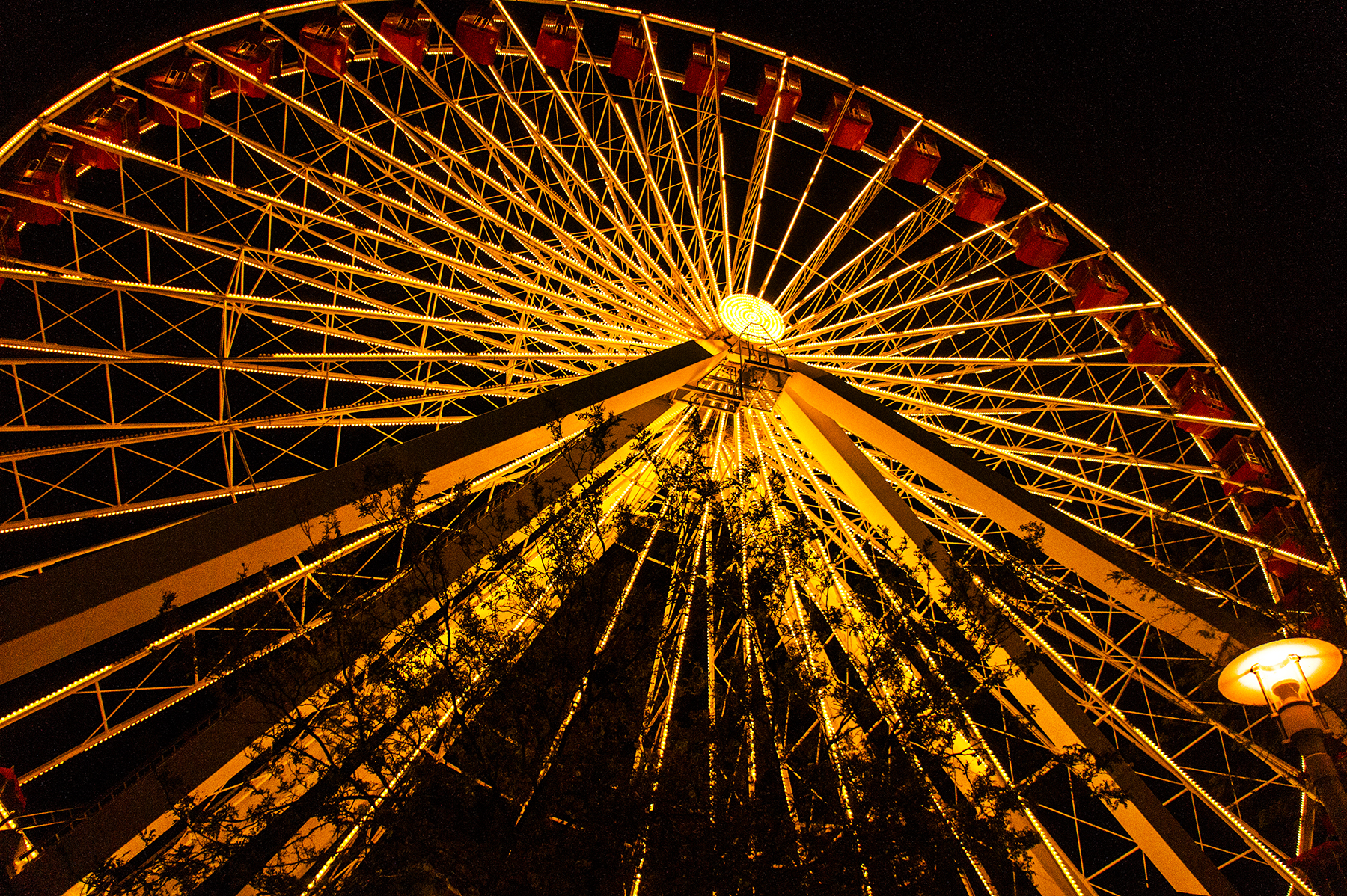 Navy Pier Ferris wheel at night, geometric light pattern against black sky, Chicago