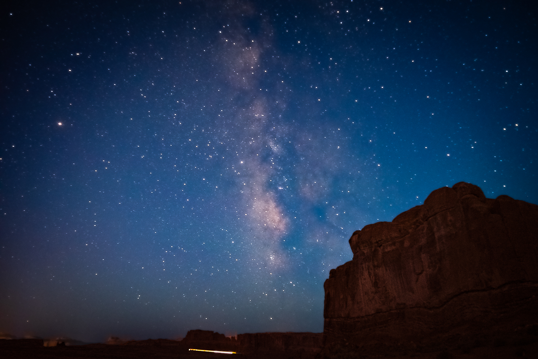 Milky Way galaxy over red rock formations, Arches National Park, Moab Utah
